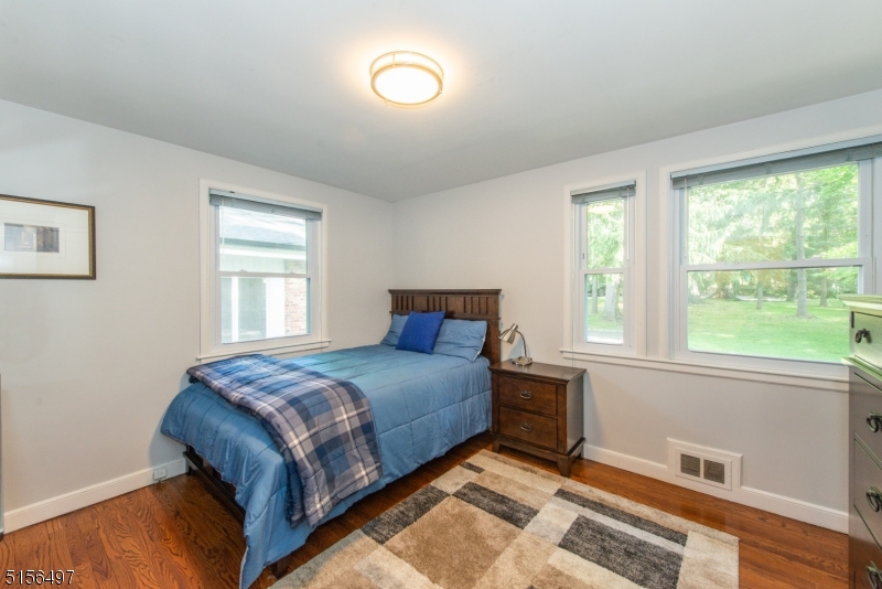 32 Parsonage Hill Road Short Hills, NJ 07078 - Photo 29 of 47 a bedroom with a bed and a window