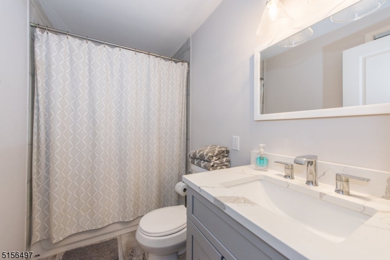 32 Parsonage Hill Road Short Hills, NJ 07078 - Photo 35 of 47 a bathroom with a sink toilet and shower