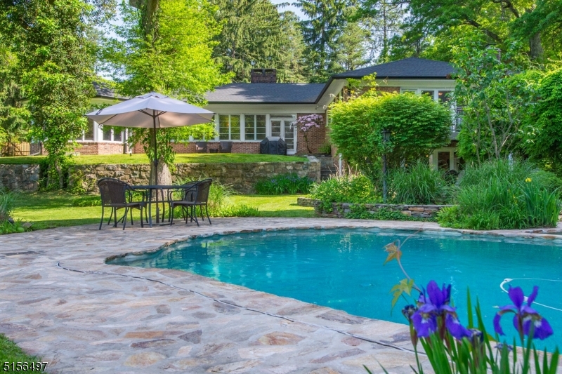 32 Parsonage Hill Road Short Hills, NJ 07078 - Photo 42 of 47 a front view of a house with swimming pool