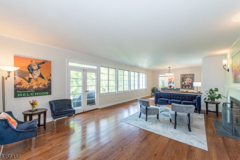32 Parsonage Hill Road Short Hills, NJ 07078 - Photo 5 of 47 a living room with furniture a wooden floor and a large window