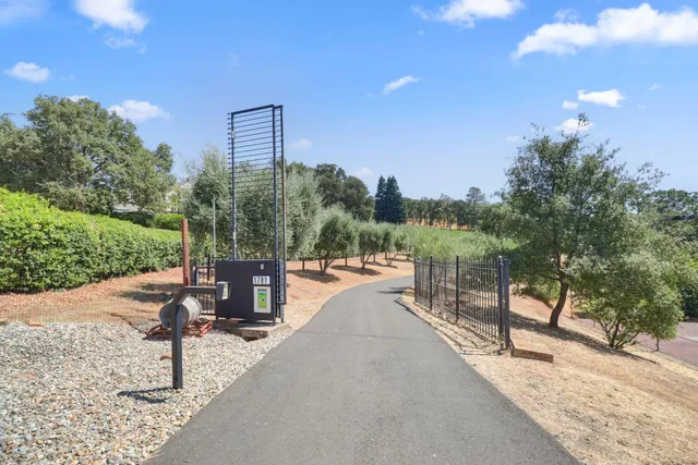 a kitchen with stainless steel appliances granite countertop wooden cabinets and dining table