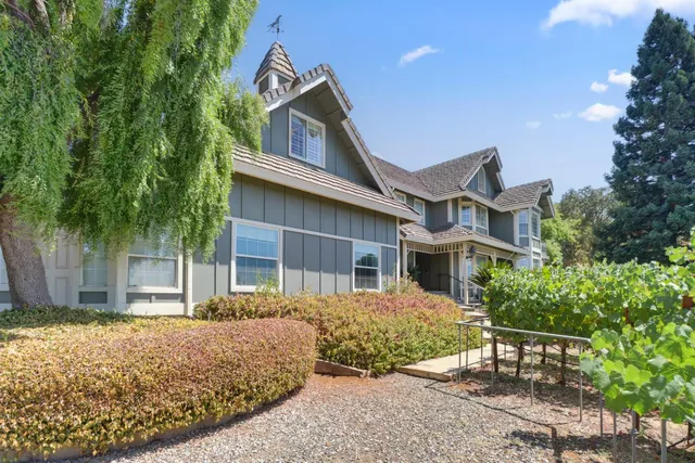a view of a room with furniture wooden floor and windows