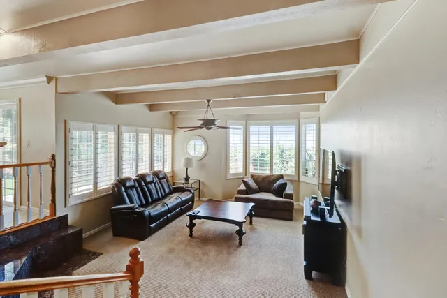a bathroom with a shower and a glass door