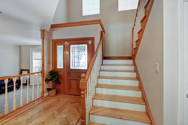 a view of a dirt road with trees in the background
