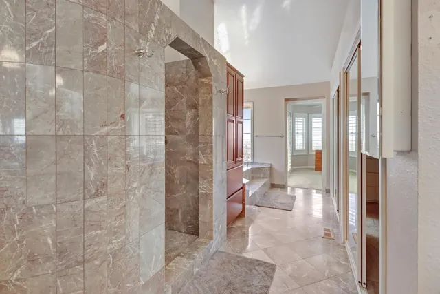 a backyard of a house with lots of green space and trees