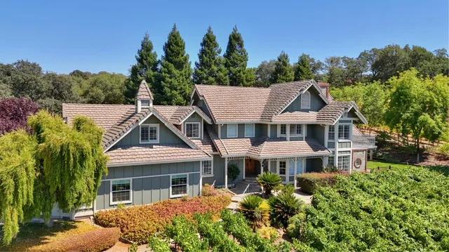 a livingroom with entryway wooden floor and windows
