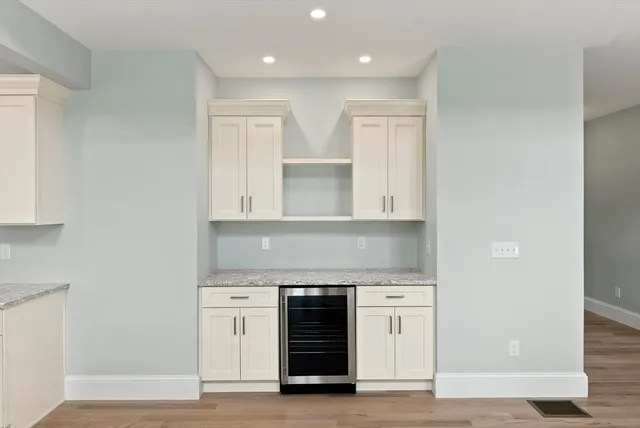 a bathroom with a double vanity sink and a toilet