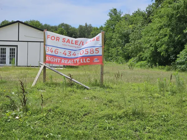 a view of a house with a big yard