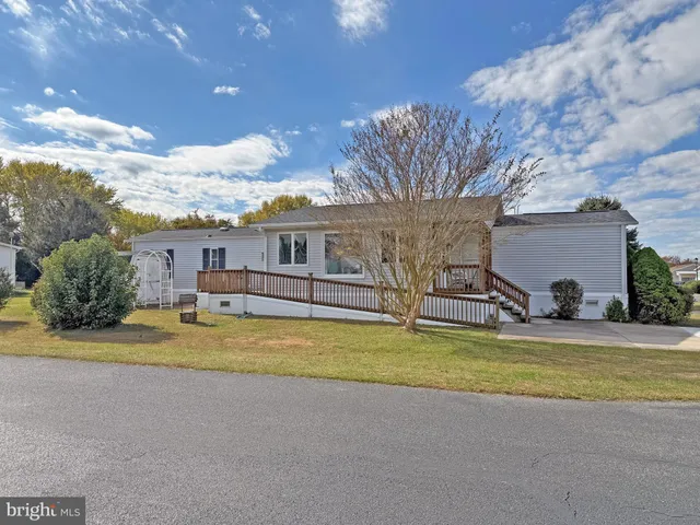 a view of a chairs and table in backyard