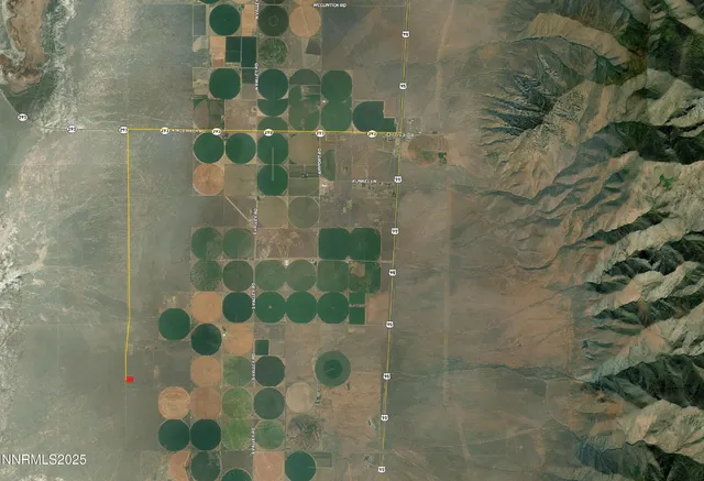 an aerial view of house with mountain view