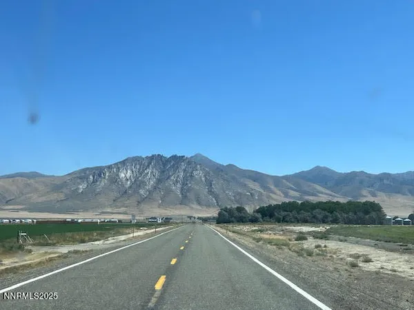 a view of a town with mountains in the background