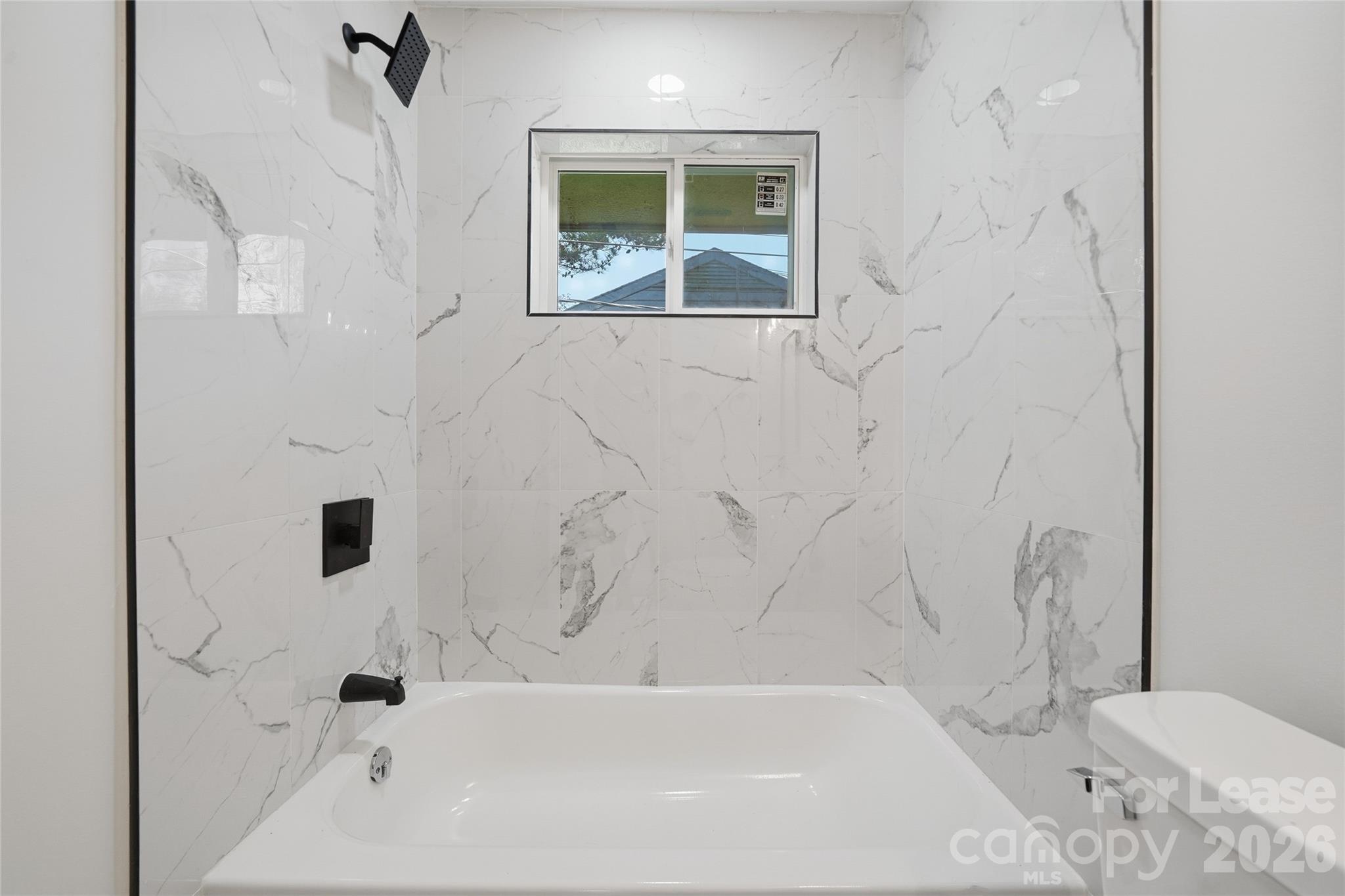 1320 Anderson Street Charlotte, NC 28205 - Photo 11 of 13 a bathroom with a bathtub