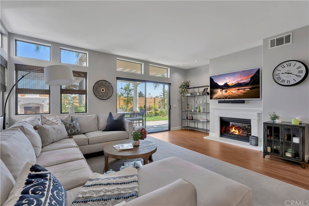 3235 Star Canyon Circle Corona, CA 92882 - Photo 16 of 75 a living room with furniture a fireplace and a large window