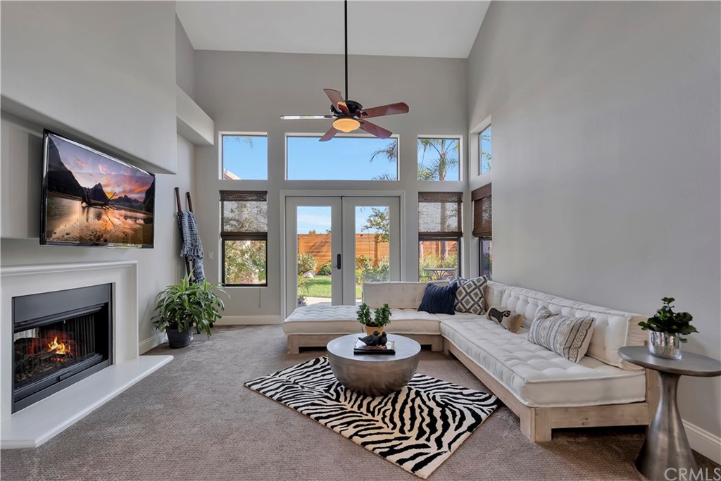 3235 Star Canyon Circle Corona, CA 92882 - Photo 23 of 75 a living room with furniture a flat screen tv and a fireplace