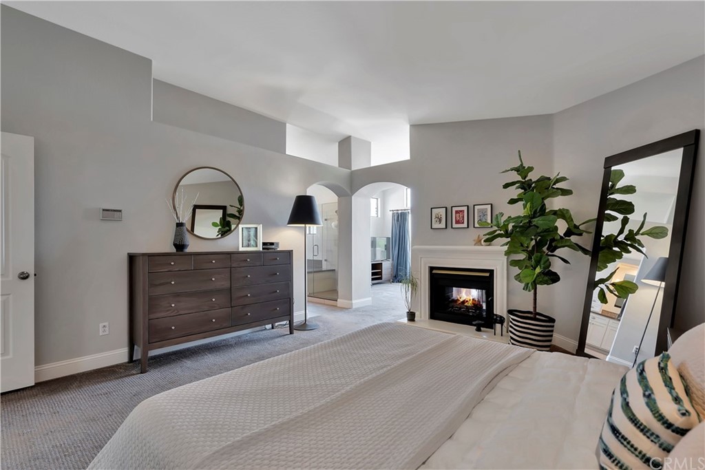 3235 Star Canyon Circle Corona, CA 92882 - Photo 43 of 75 a bedroom with a bed and a fireplace