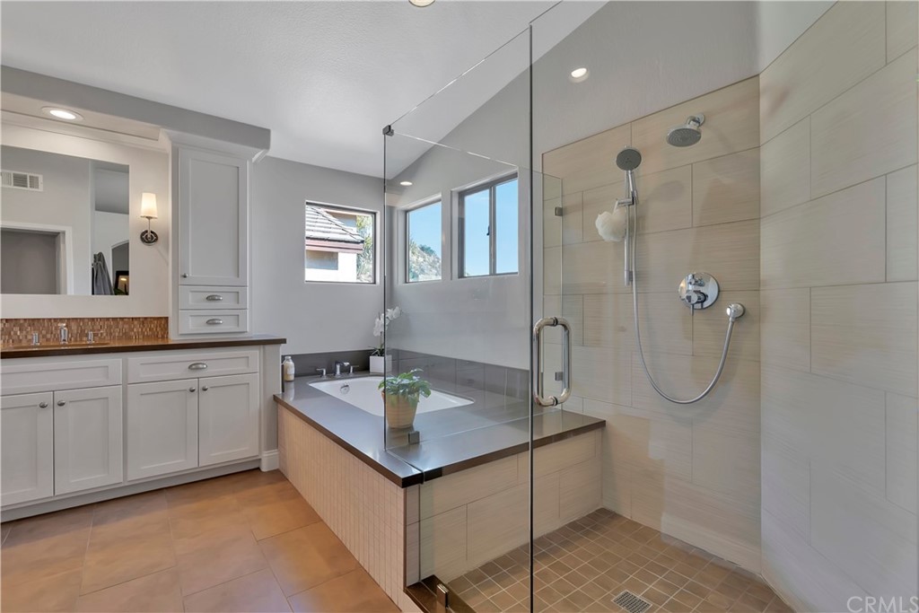 3235 Star Canyon Circle Corona, CA 92882 - Photo 45 of 75 a bathroom with a granite countertop sink mirror and shower