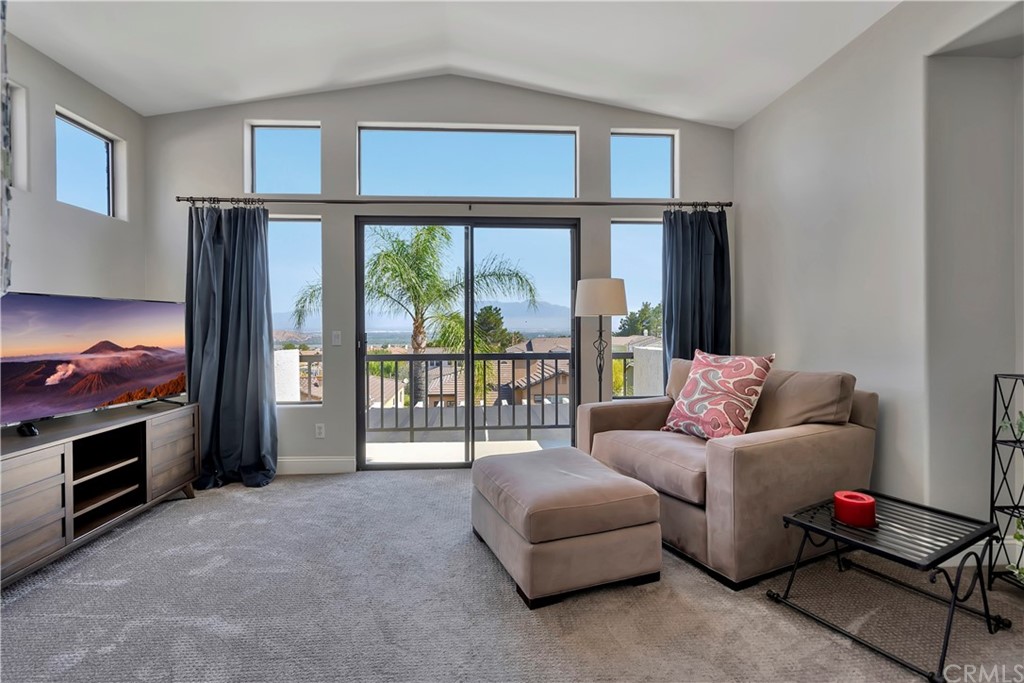 3235 Star Canyon Circle Corona, CA 92882 - Photo 47 of 75 a living room with furniture and a floor to ceiling window