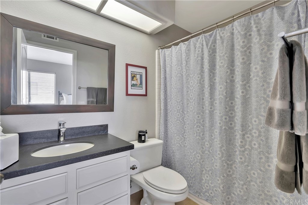 3235 Star Canyon Circle Corona, CA 92882 - Photo 53 of 75 a bathroom with a granite countertop sink toilet and mirror