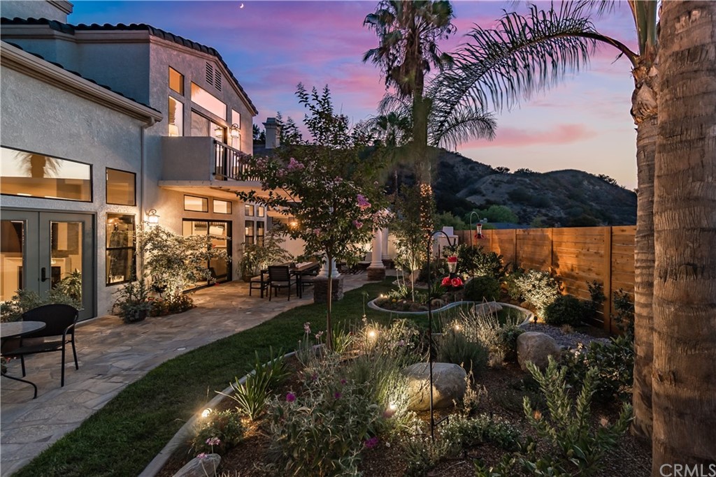 3235 Star Canyon Circle Corona, CA 92882 - Photo 62 of 75 a view of a lake with a house in the background