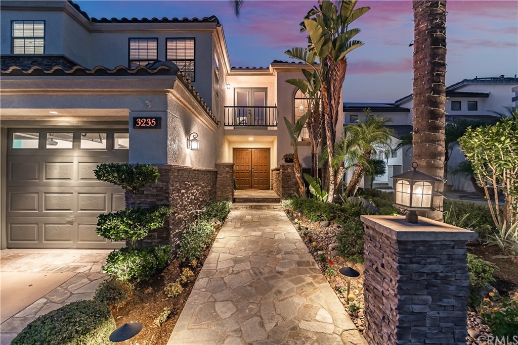 3235 Star Canyon Circle Corona, CA 92882 - Photo 9 of 75 a front view of a house with a yard