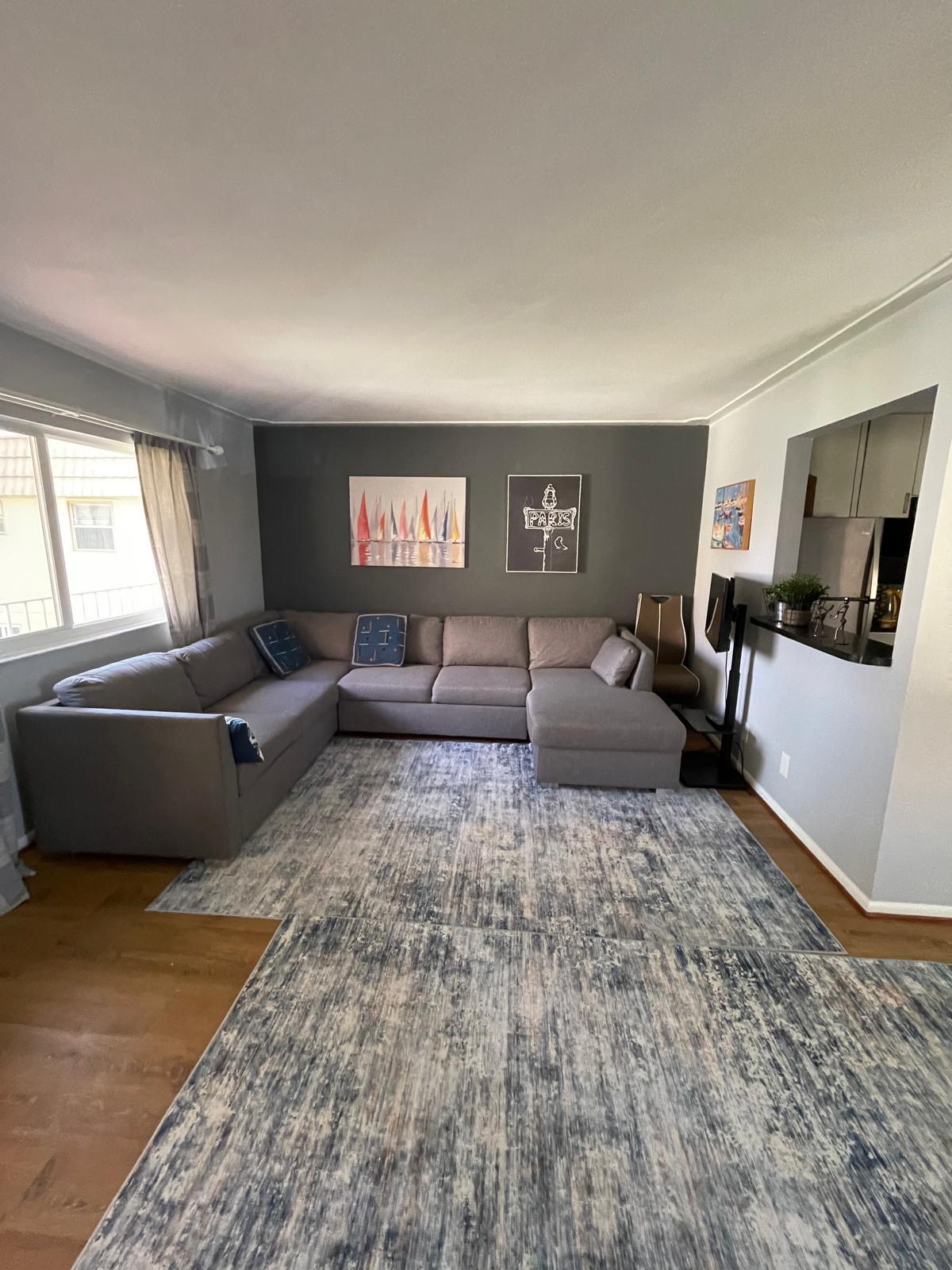 E Saxony Lane East, Unit 230 Delray Beach, FL 33446 - Photo 8 of 22 a living room with furniture and a couch