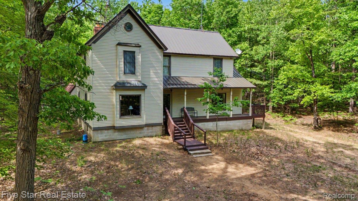175 Bishop Road Sterling, MI 48659 - Photo 2 of 41 Two-story residence featuring light-toned siding and a durable metal roof