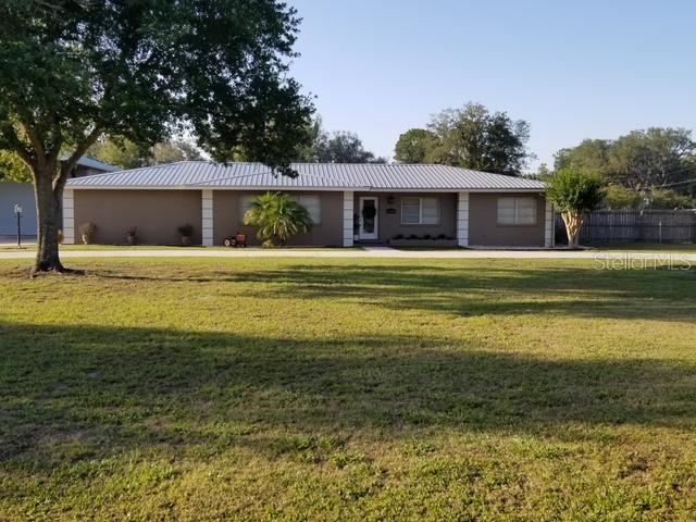 1105 Thomas Road Lakeland, FL 33809 - Photo 1 of 1 a front view of a house with a garden