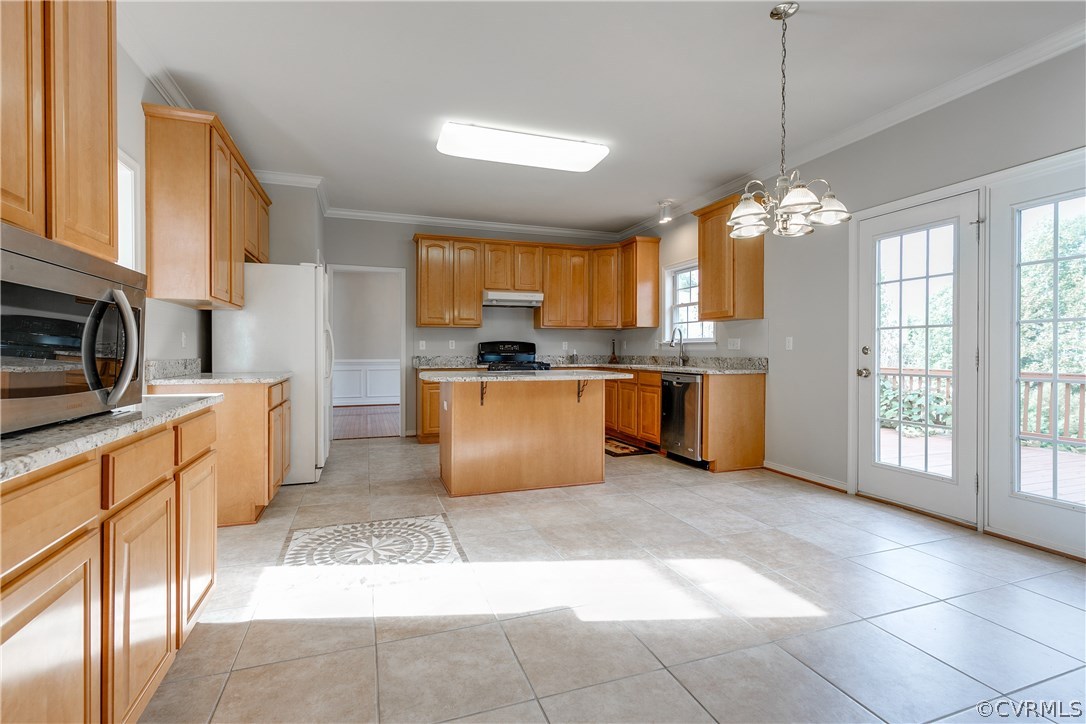 1418 Goswick Ridge Road Midlothian, VA 23114 - Photo 15 of 47 a kitchen with stainless steel appliances granite countertop a stove top oven a refrigerator a sink dishwasher with a dining table and chairs
