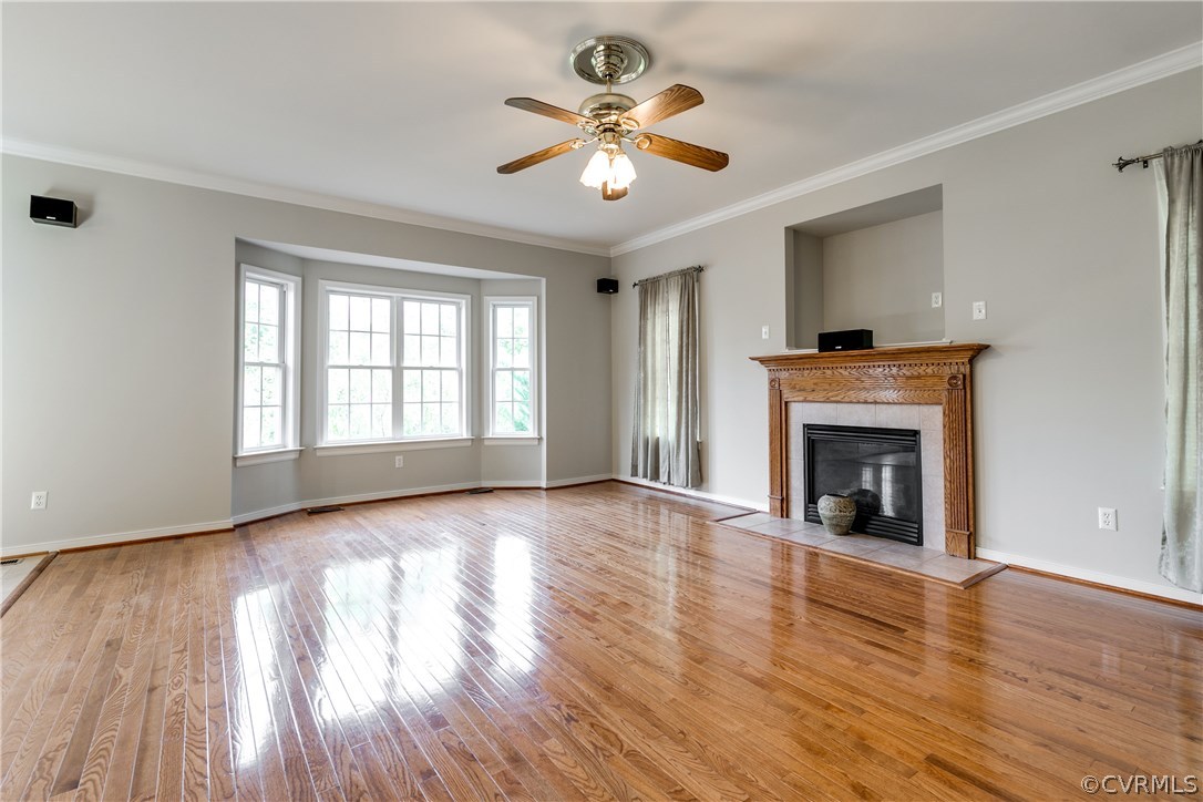 1418 Goswick Ridge Road Midlothian, VA 23114 - Photo 18 of 47 a view of an empty room with wooden floor fireplace and a window
