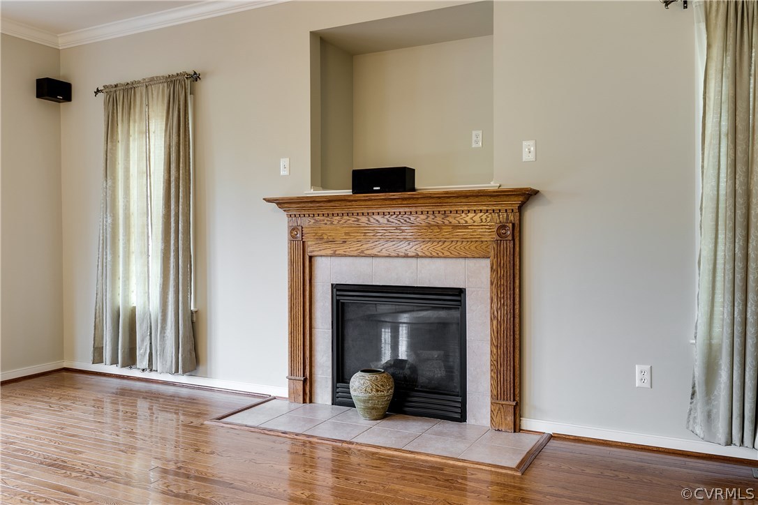 1418 Goswick Ridge Road Midlothian, VA 23114 - Photo 19 of 47 a view of an empty room with wooden floor and a window