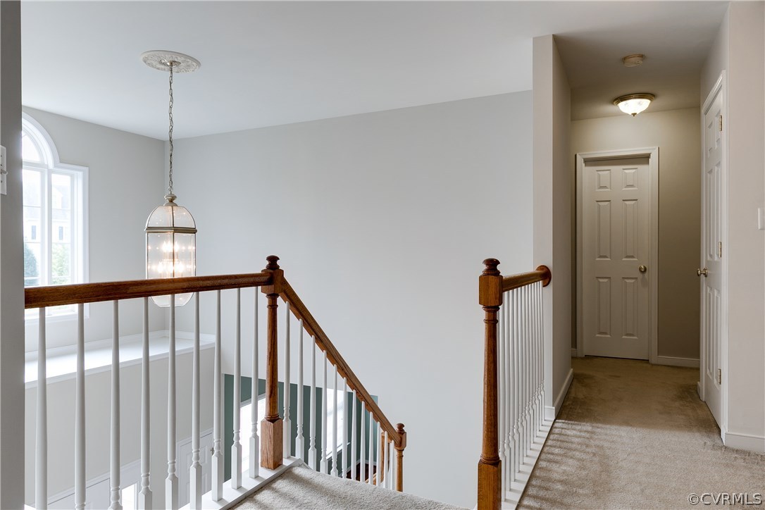 1418 Goswick Ridge Road Midlothian, VA 23114 - Photo 21 of 47 a view of a hallway with windows and stairs