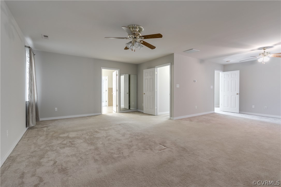 1418 Goswick Ridge Road Midlothian, VA 23114 - Photo 23 of 47 a view of a livingroom with a ceiling fan and window