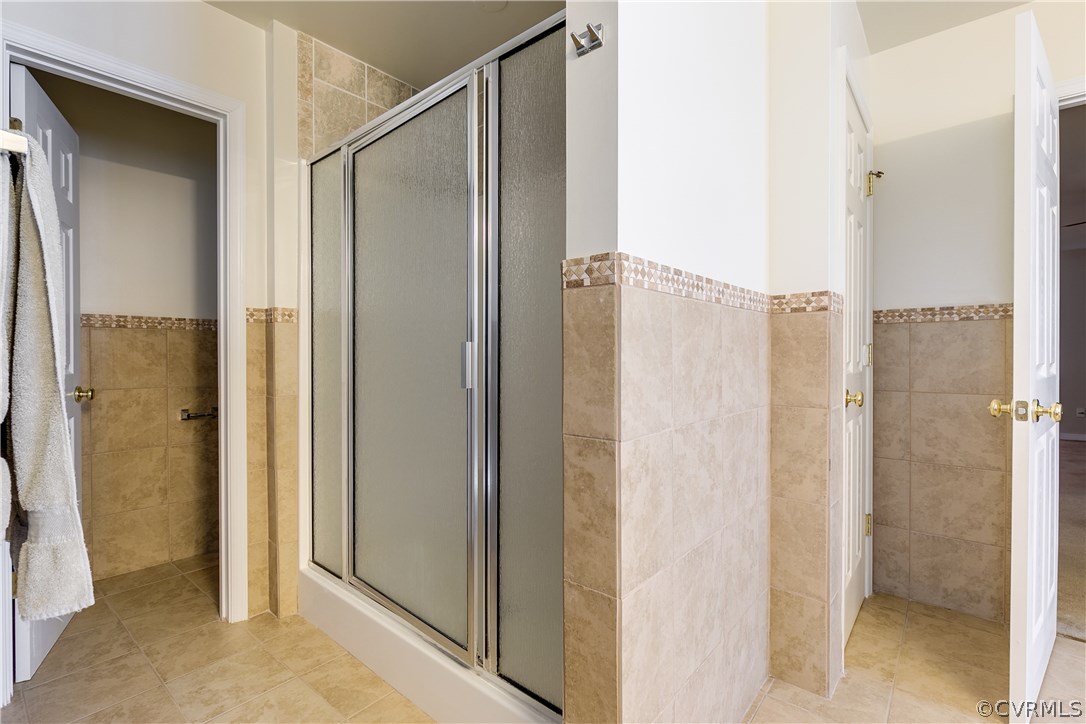 1418 Goswick Ridge Road Midlothian, VA 23114 - Photo 27 of 47 a bathroom with a shower and a glass door