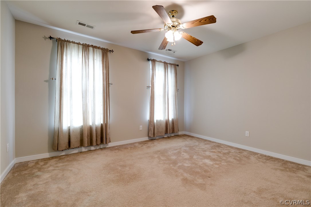 1418 Goswick Ridge Road Midlothian, VA 23114 - Photo 28 of 47 an empty room with windows and ceiling fan