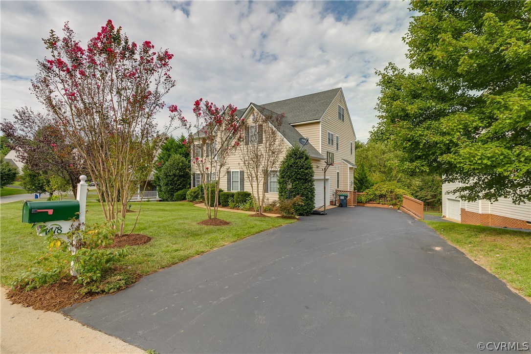 1418 Goswick Ridge Road Midlothian, VA 23114 - Photo 47 of 47 a front view of a house with a yard and fountain