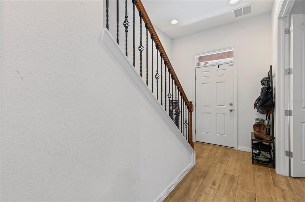 5119 Jones Road St. Cloud, FL 34771 - Photo 13 of 41 a view of a hallway with wooden floor and entryway