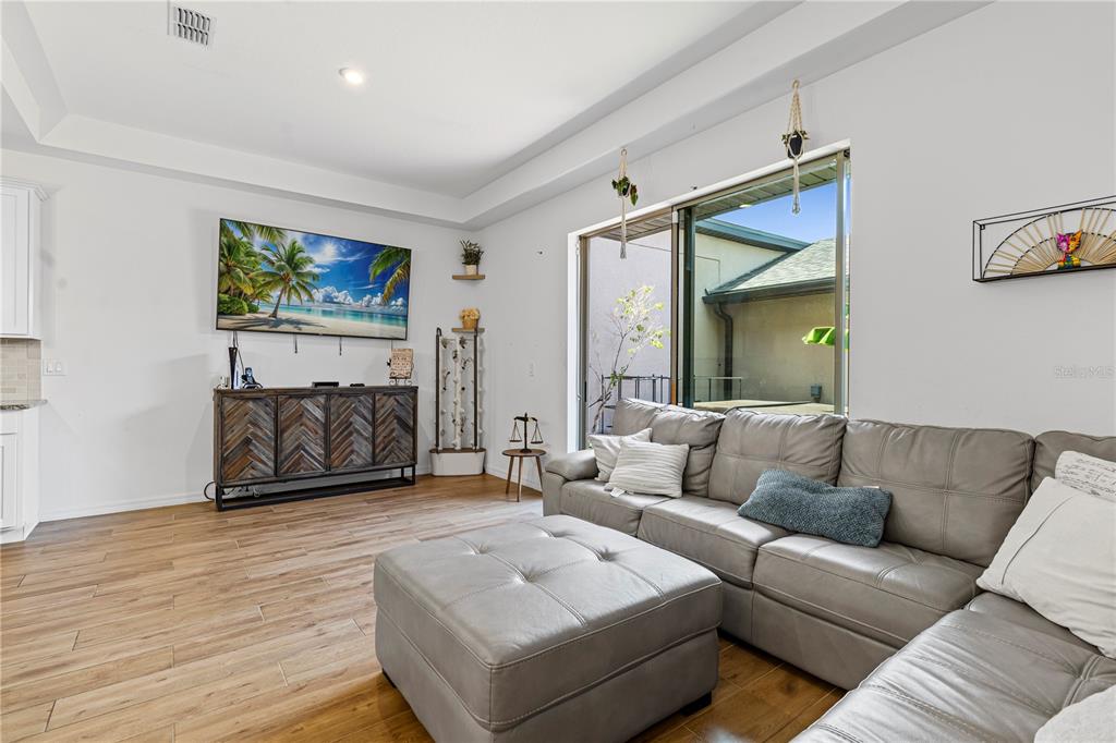 5119 Jones Road St. Cloud, FL 34771 - Photo 21 of 41 a living room with furniture and a flat screen tv