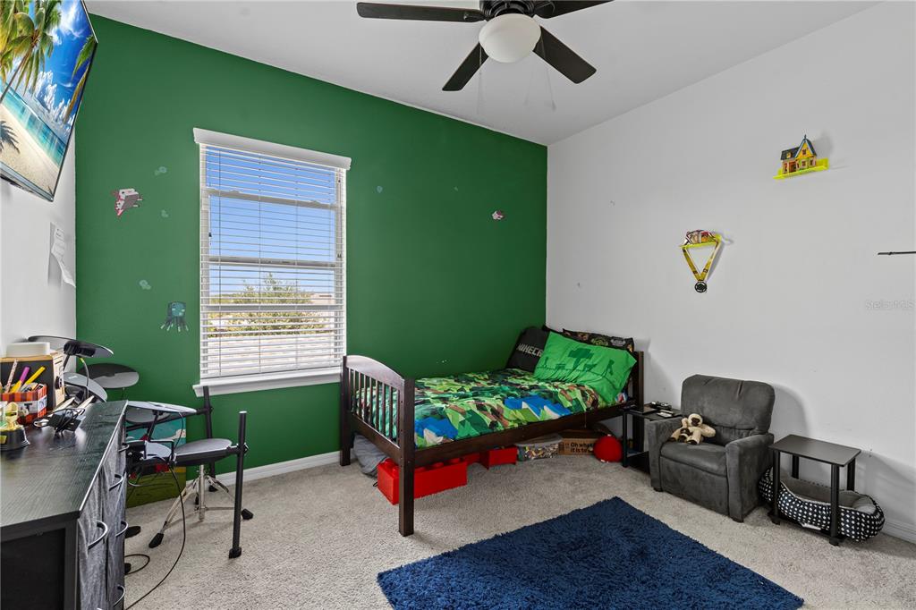 5119 Jones Road St. Cloud, FL 34771 - Photo 27 of 41 a bedroom with a workspace