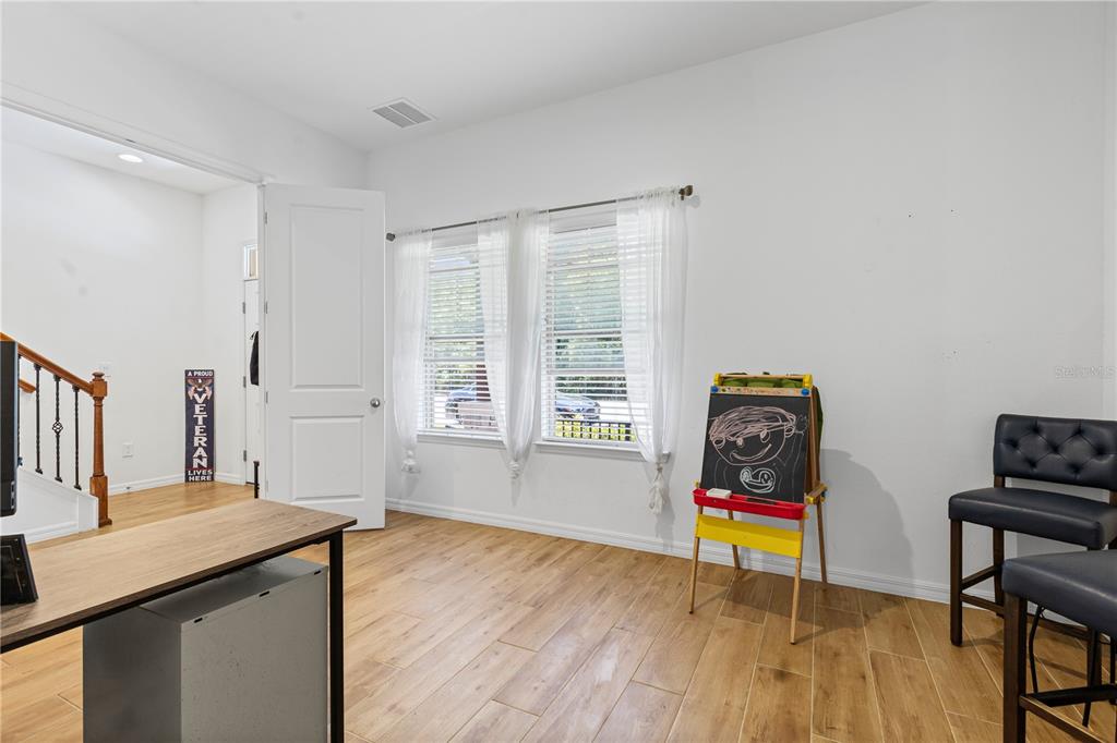 5119 Jones Road St. Cloud, FL 34771 - Photo 31 of 41 a living room with furniture and a wooden floor