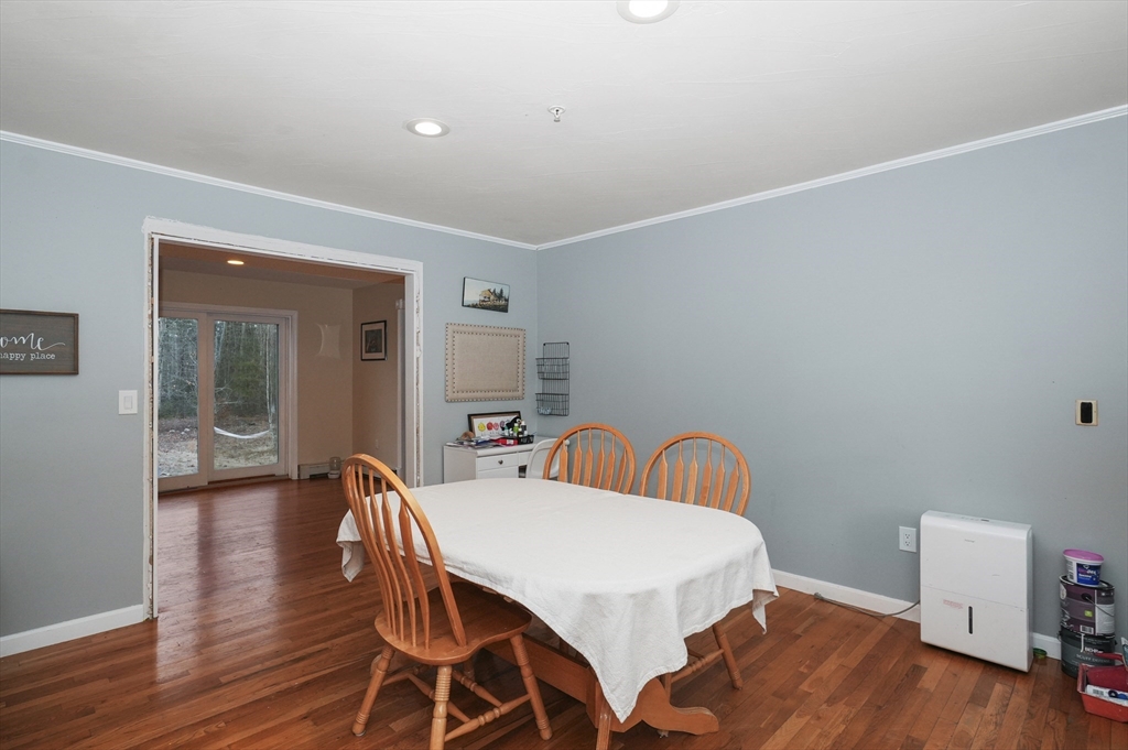 24 North End Road Townsend, MA 01469 - Photo 11 of 35 a view of a dining room with furniture and wooden floor