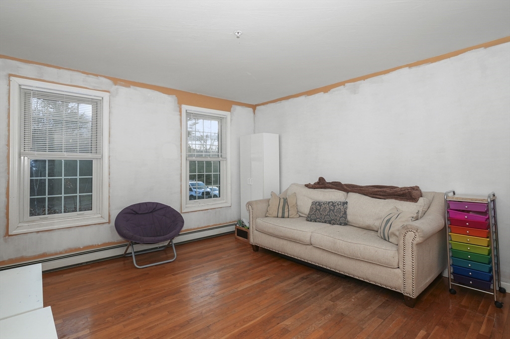 24 North End Road Townsend, MA 01469 - Photo 15 of 35 a living room with furniture and a window