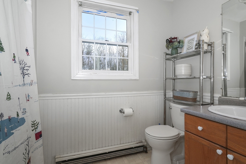 24 North End Road Townsend, MA 01469 - Photo 17 of 35 a bathroom with a sink toilet and shower