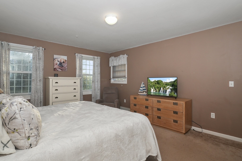 24 North End Road Townsend, MA 01469 - Photo 19 of 35 a bedroom with a bed and a dresser