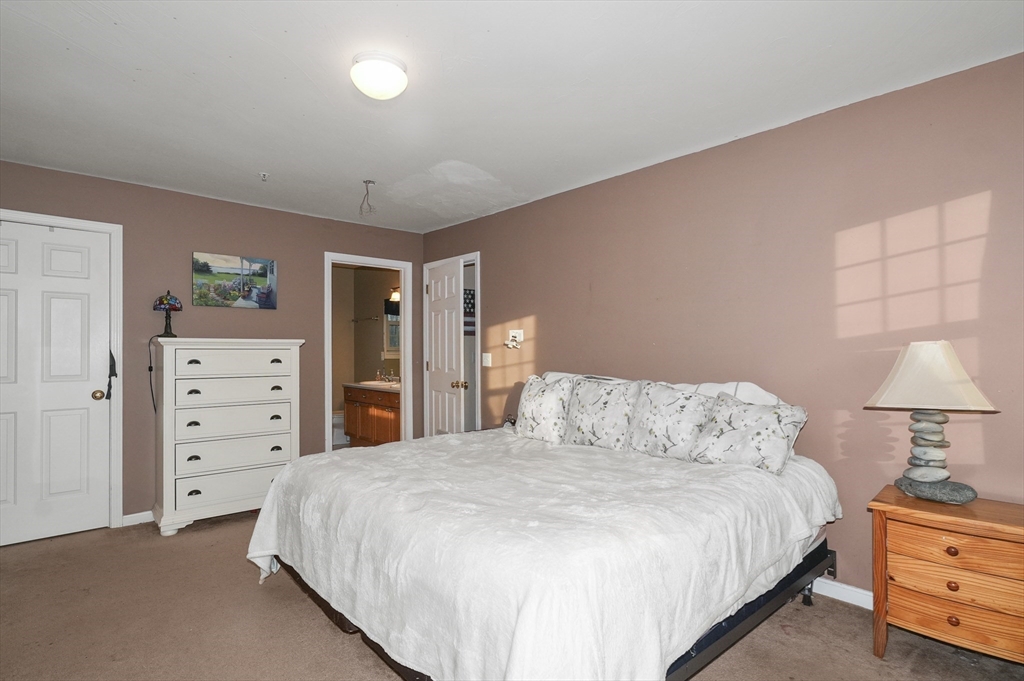 24 North End Road Townsend, MA 01469 - Photo 20 of 35 a bedroom with a bed and a closet