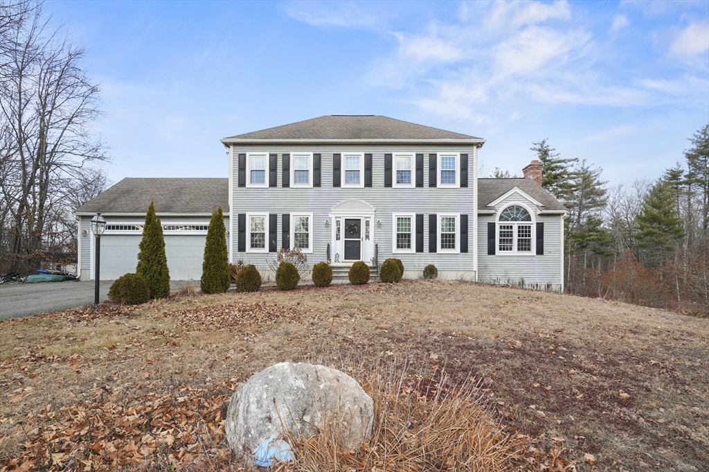 24 North End Road Townsend, MA 01469 - Photo 2 of 35 a front view of a house with a yard
