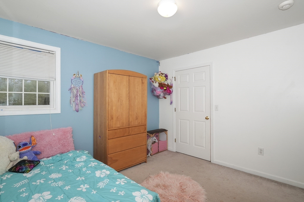 24 North End Road Townsend, MA 01469 - Photo 24 of 35 a bedroom with a bed and a window