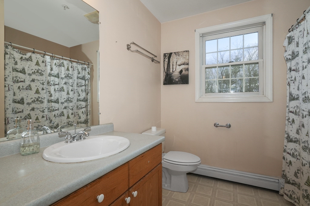 24 North End Road Townsend, MA 01469 - Photo 26 of 35 a bathroom with a sink toilet and shower