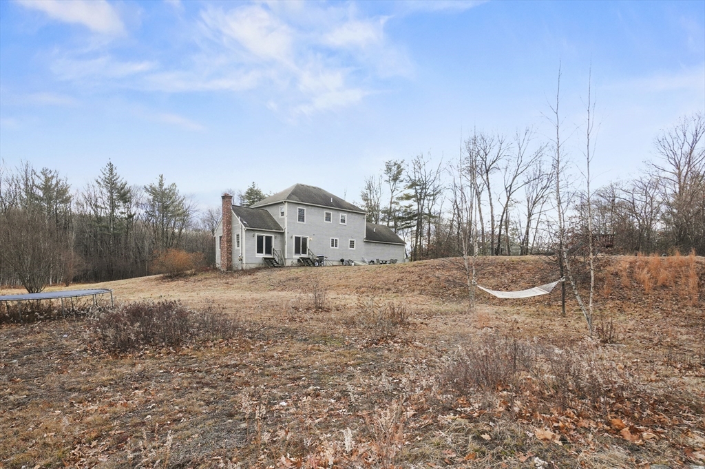 24 North End Road Townsend, MA 01469 - Photo 31 of 35 a view of a house with a yard