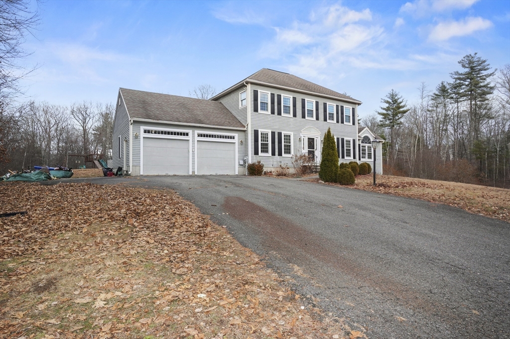 24 North End Road Townsend, MA 01469 - Photo 33 of 35 a view of a house with a yard