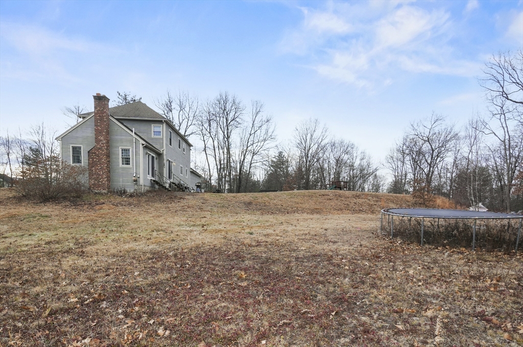 24 North End Road Townsend, MA 01469 - Photo 34 of 35 a view of a house with a yard
